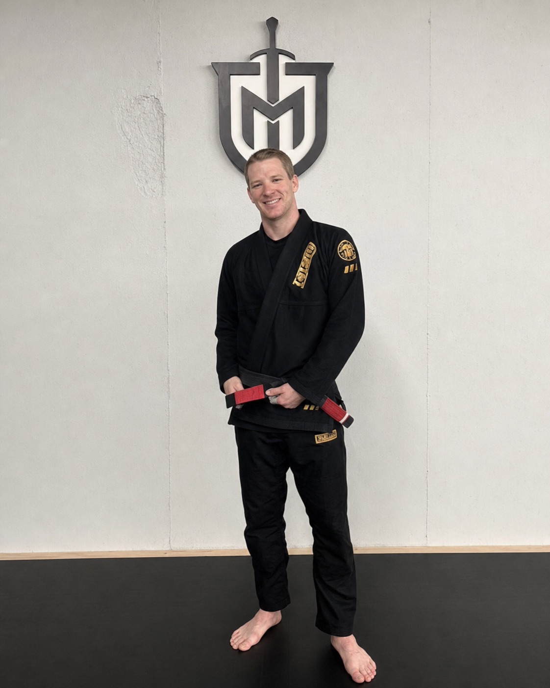 Professor Justin Hale wearing a black gi at Meta Jiu Jitsu Academy